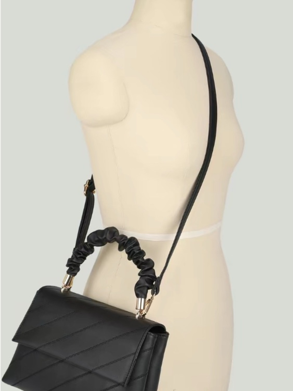 Black Quilted Satchel with Ruched Top Handle and Gold Hardware